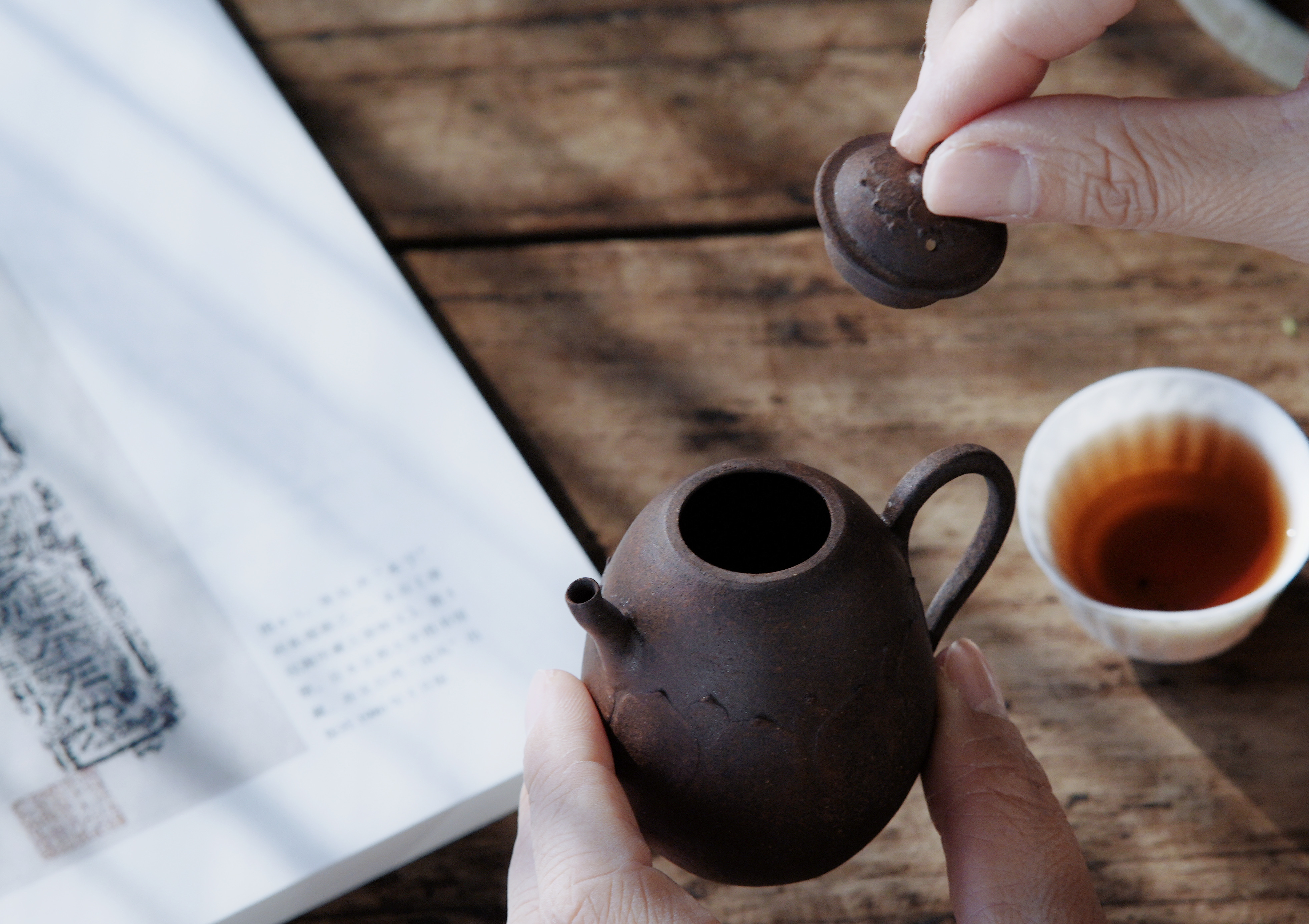 Master craftsman shaping a teapot